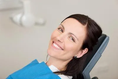 woman smiling during her cosmetic dentistry appointment at Danos Dental